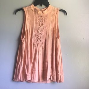 Sleeveless peach blouse